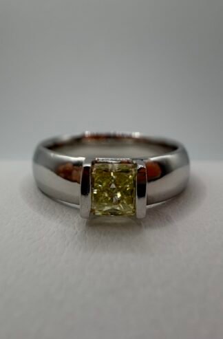 Fancy Yellow Natural Diamond and Platinum Ring .42 Carat Center Stone