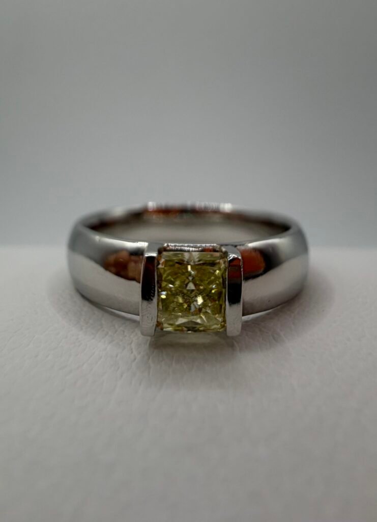 Fancy Yellow Natural Diamond and Platinum Ring .42 Carat Center Stone